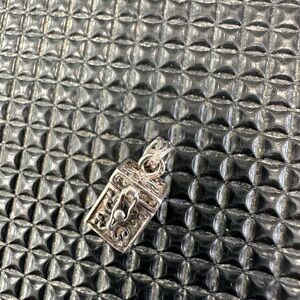 Intricate Silver Charm Pendant